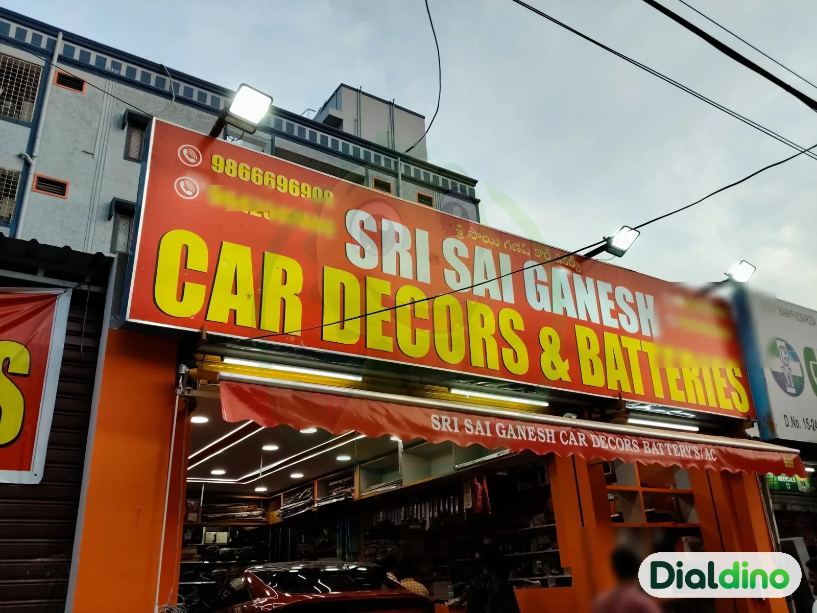Sri Sai Ganesh Car Decors & Batteries, signboard