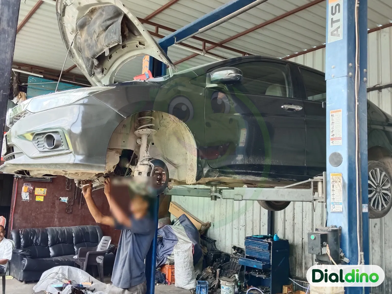 Universal Car Care, car on the lift